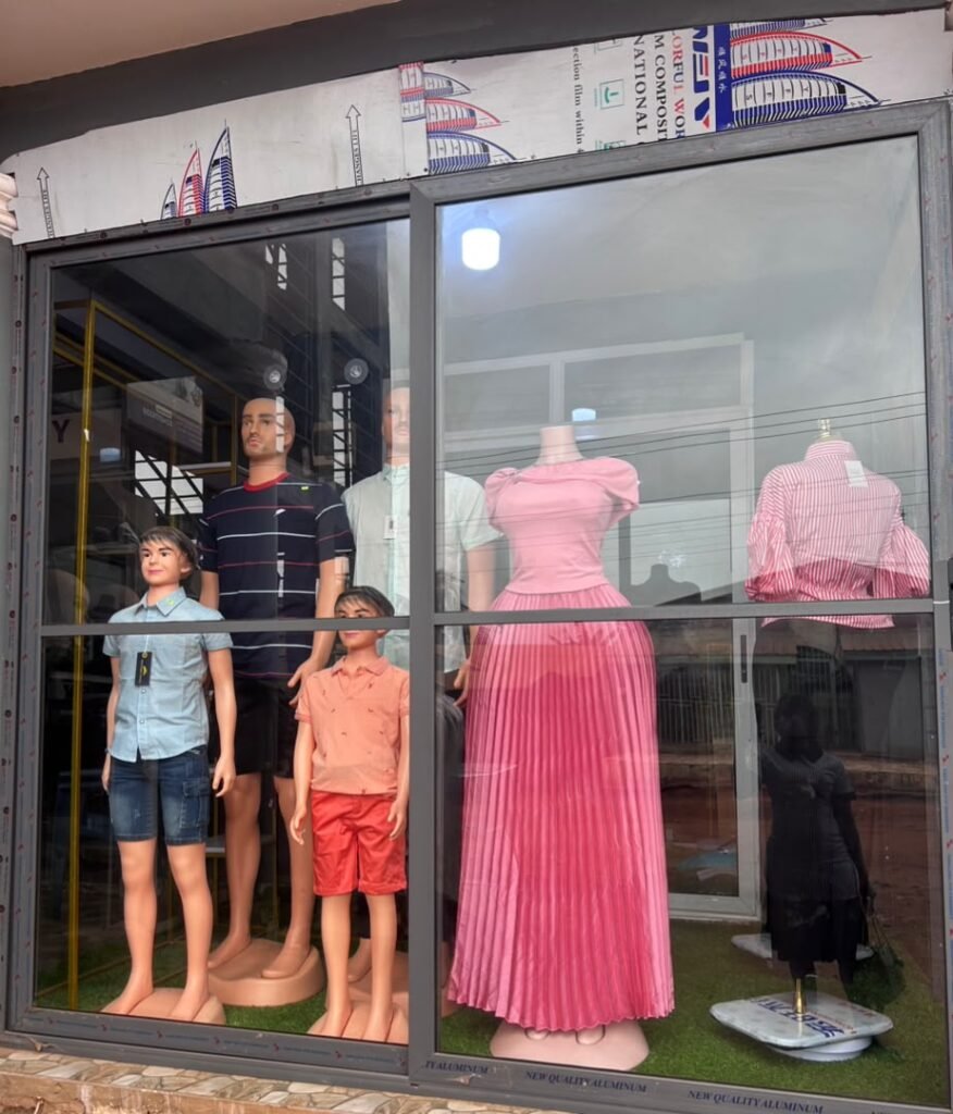 The Pels Unisex Kloset shop front in Tema Community 22 Annex, Washington Station, with dressed mannequins in the window