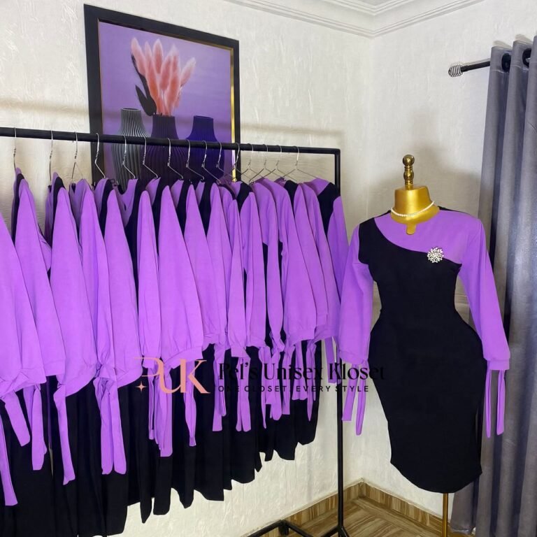 Black corporate dress with a lilac asymmetric shoulder panel, lilac sleeves and tie cuffs