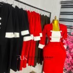 Red corporate dress with a white bib front panel, white cuffs and white buttons