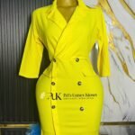 Bright yellow double-breasted blazer dress with notch lapels and dark buttons