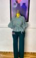 Green and white striped peplum shirt with tie waist paired with dark green wide-leg trousers