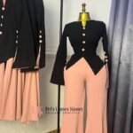 Black long-sleeve peplum top with peach buttons paired with peach flared trousers