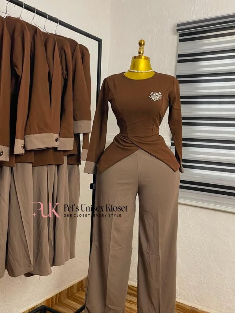 Chocolate brown long-sleeve peplum top with taupe cuffs paired with taupe wide-leg trousers